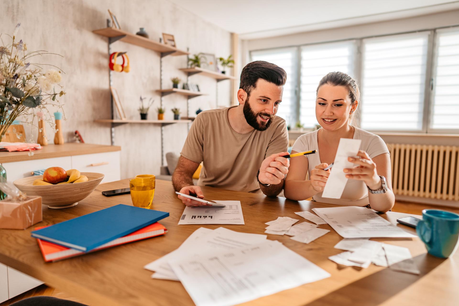 Couple checking their finances at home