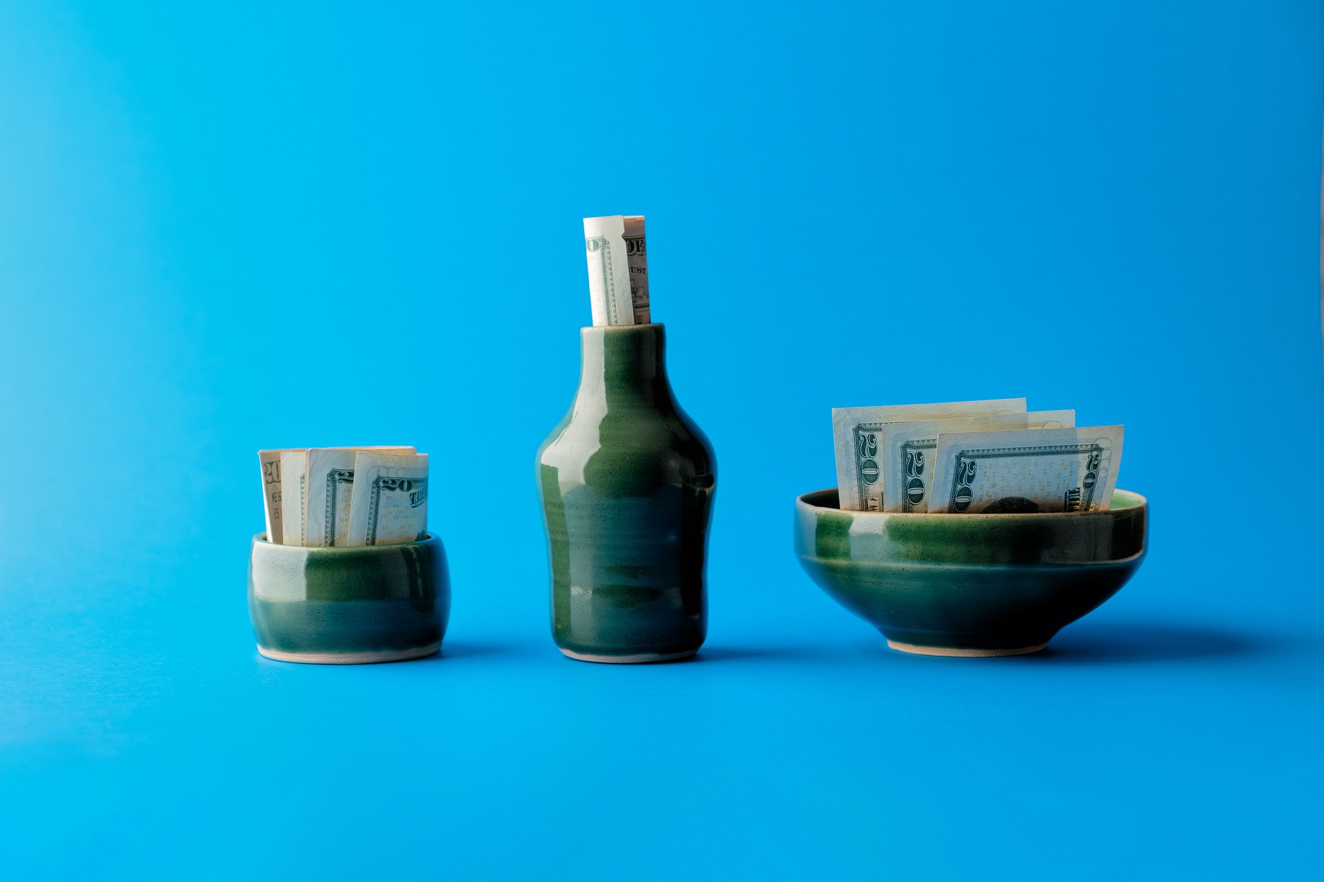 Investment Diversification Metaphor, USD Bills in Various Green Containers